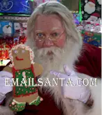 Santa with gingerbread cookie. Santa loves Christmas cookies too!